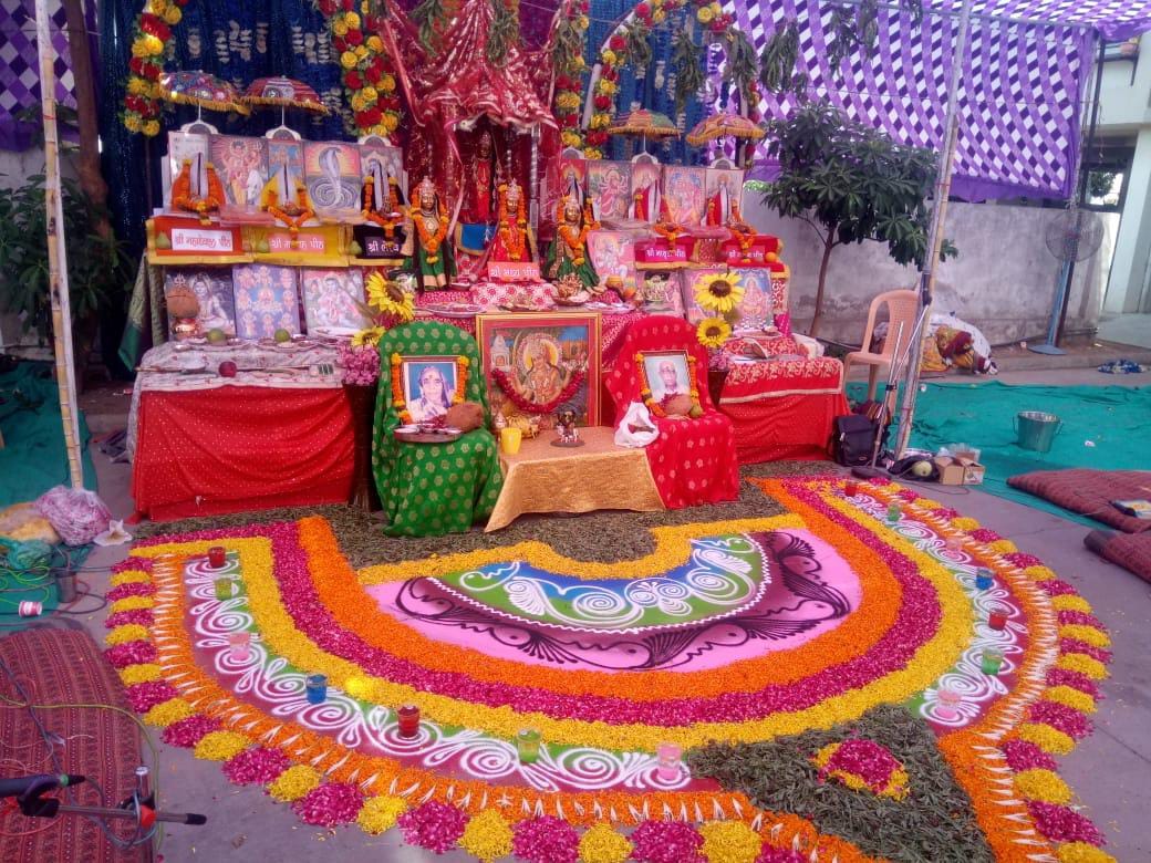Puja with beautiful flower rangoli